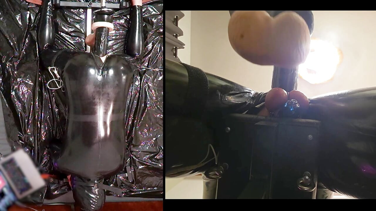 Session in the pillory with Latex Catsuit, PA Chastity, Giant Didildo and Estim