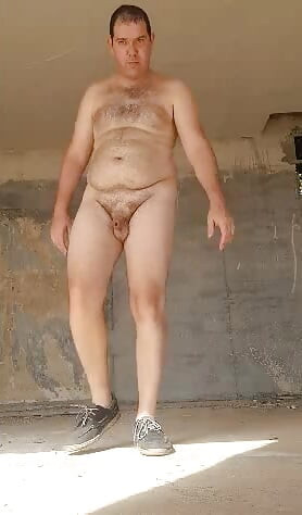 Boy nude in in an abandoned building