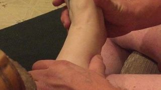 Putting lotion on her beautiful feet