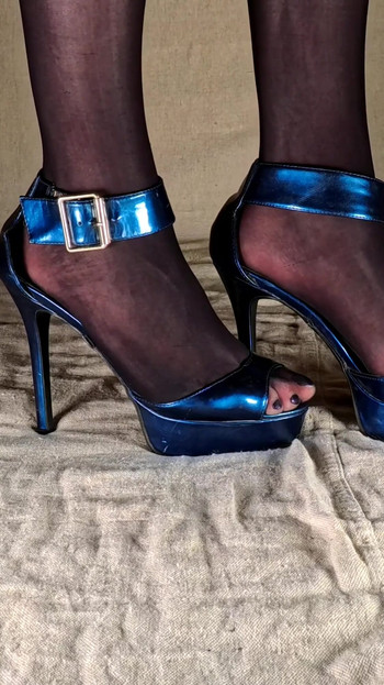 Key moment from "Shiny Black Pantyhose and Hot High Heels - Young Gay Crossdresser"