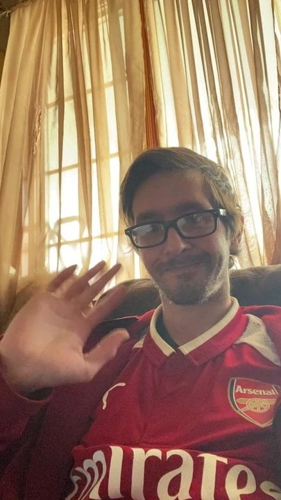 Mr. Arsenal waving hello