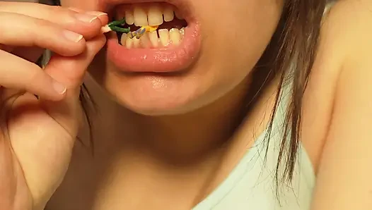 Giantess Girl Unwraps a Candy but Is Surprised Because There Is a Tiny Man in the Candy Bag - She Is Curious to See What It
