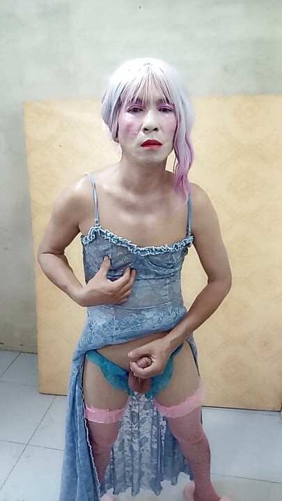 Oanh Le shemale eyes sexy dress porn standing with a happy cock leaning on her back
