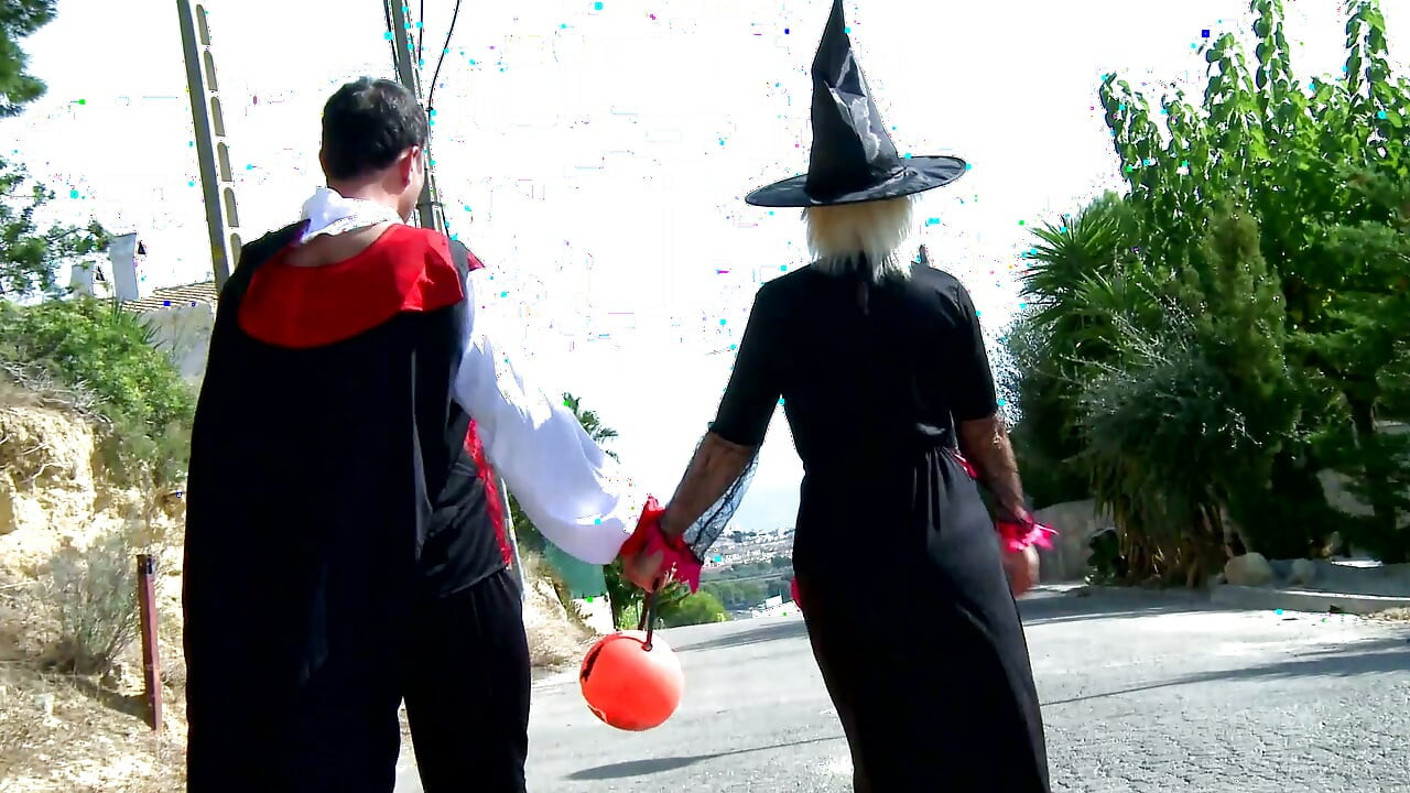 Hot blonde with big tits roughly fucked by two bad guys in the woods dressed up for Halloween