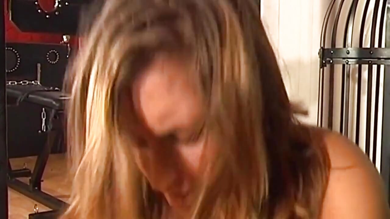 Blindfolded Brunette MILF Chained for Steamy Dungeon Play