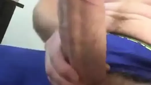 Guy stroking his massive thick cock