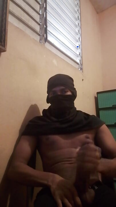 Masked big black cock masturbates