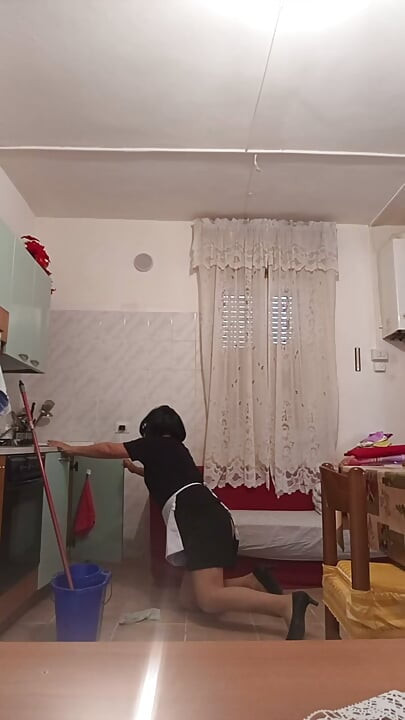 Transvestite does house cleaning