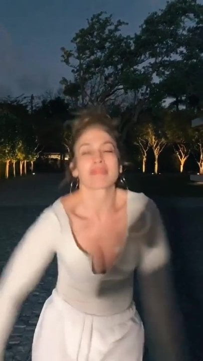Jennifer Lopez showing cleavage as she dances
