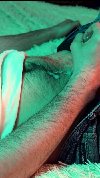 Captivating moment from "a young hot guy watches porn on his phone and jerks off his small cock."