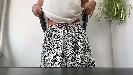 Horny stepmom Michelle puts her sexy feet in high heels on the desk.