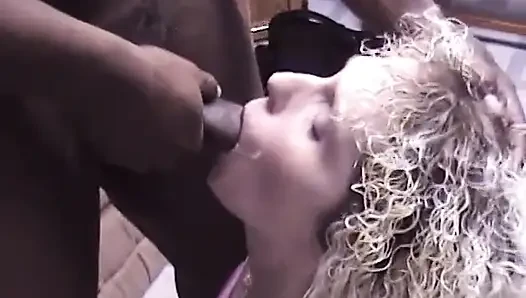 Amature blonde babe sucks dude's black dick in the living room
