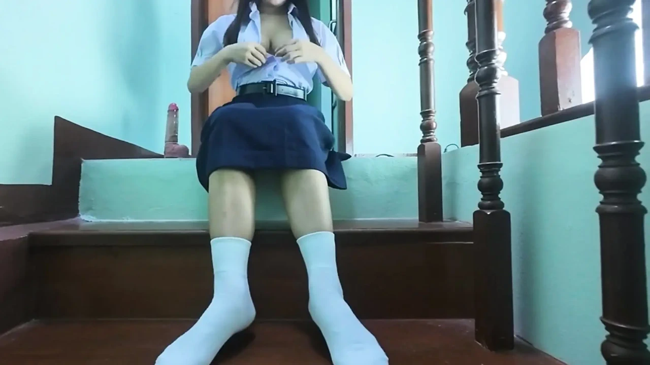 High school student fake on the stairs of a Real Thai Solo house