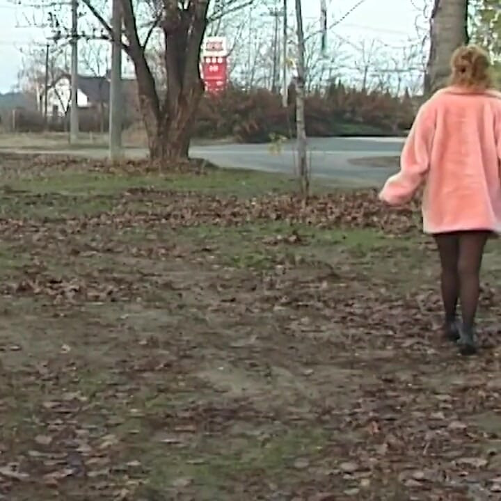 Redhead wife pissing in outdoor