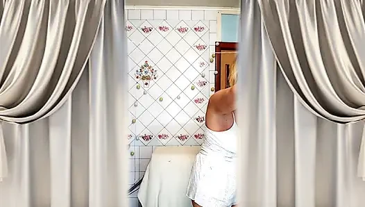Hot housewife Lukerya. A mature Ukrainian woman shows off her figure and poses for the camera at home.