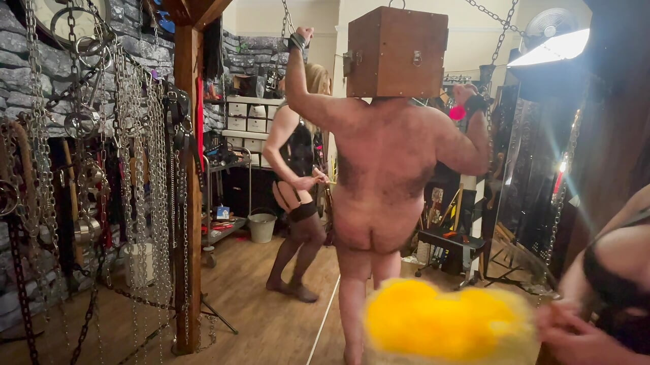 Part 2:-Satana and Mistress Carrie with slave for a sensory deprivation box