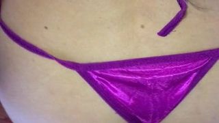 Dancing both in purple satin thong