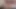 Tanned blonde ladyboy in pink dress masturbates solo in bed