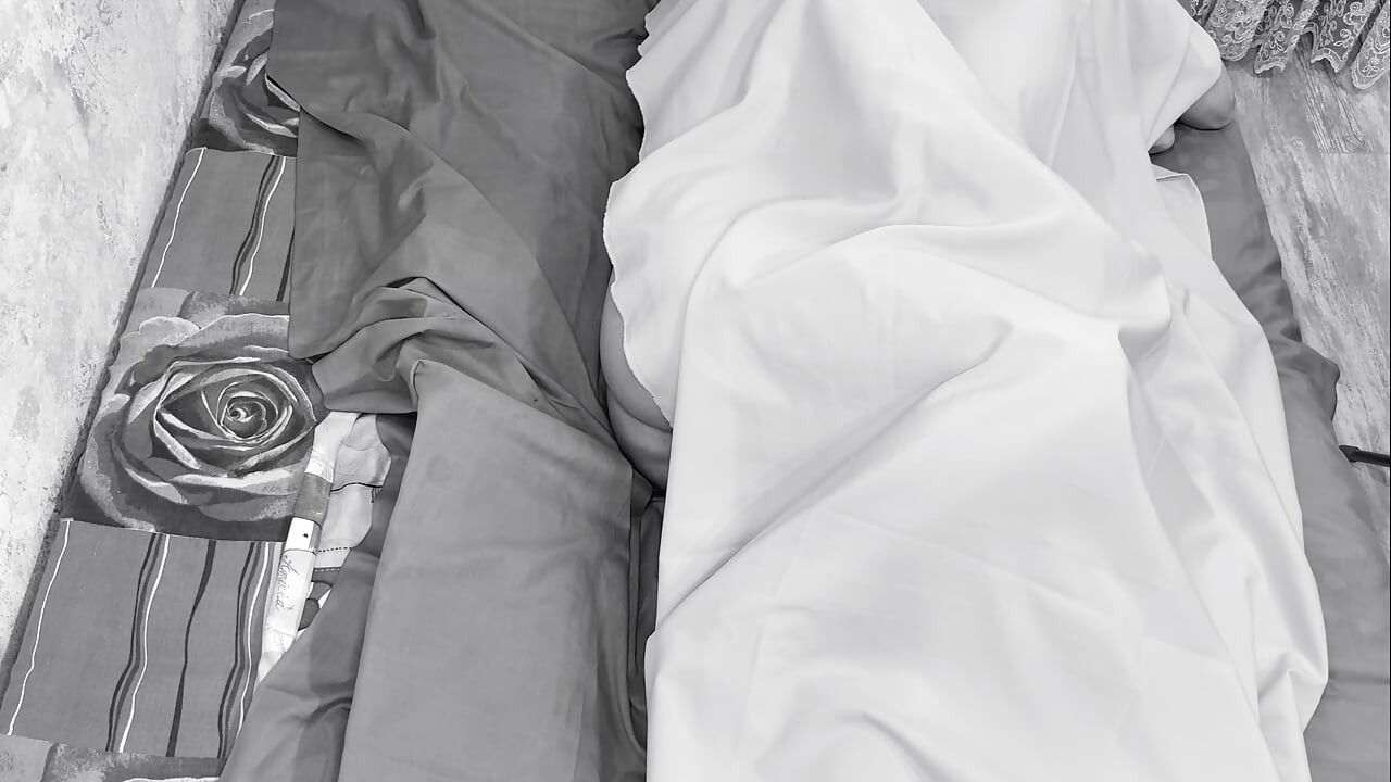 Couple caught on camera having sex in bed .