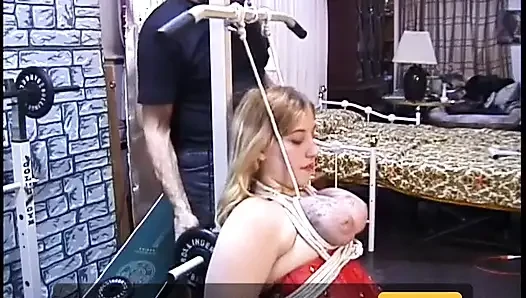 Her tits and hands are roped