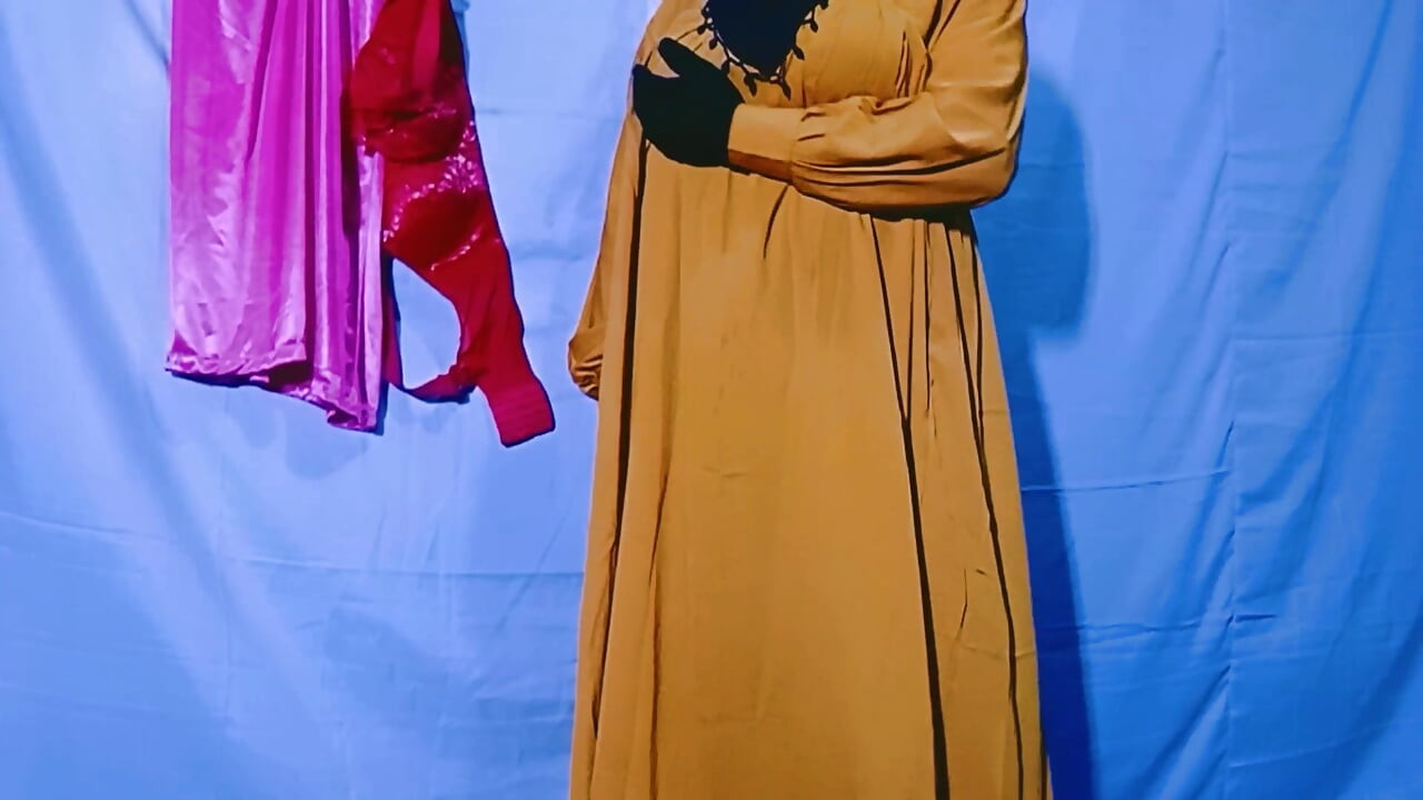 Indian wife sewing on the machine but she has other thoughts too
