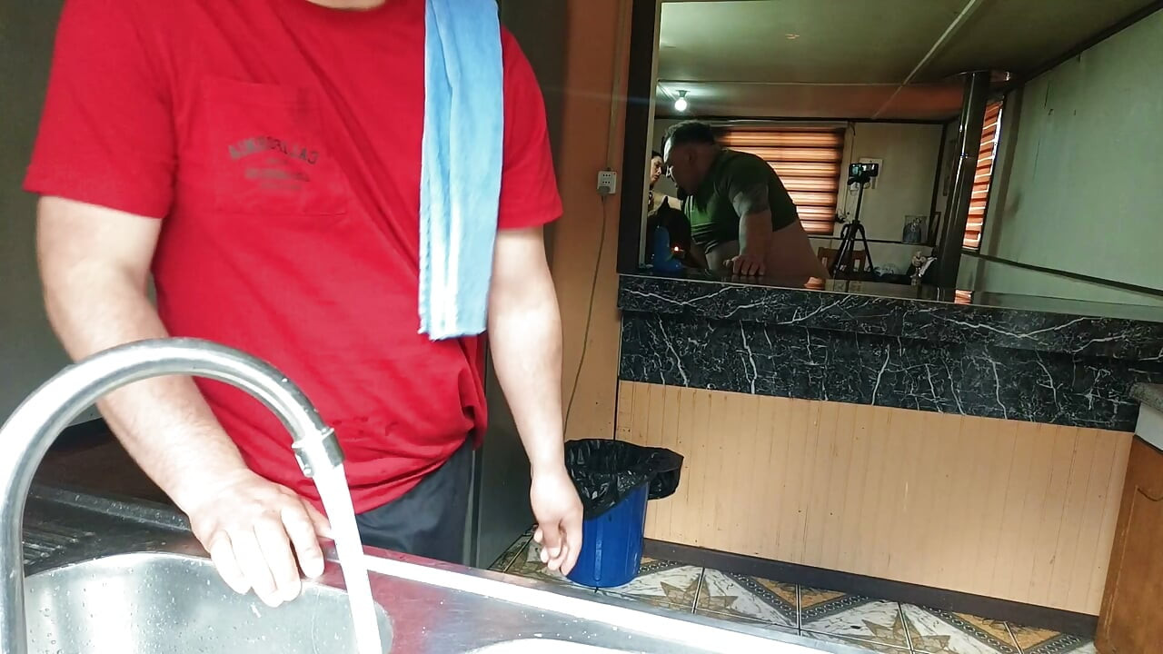 The cuckold is in the kitchen while his friend fucks his unfaithful wife right there.