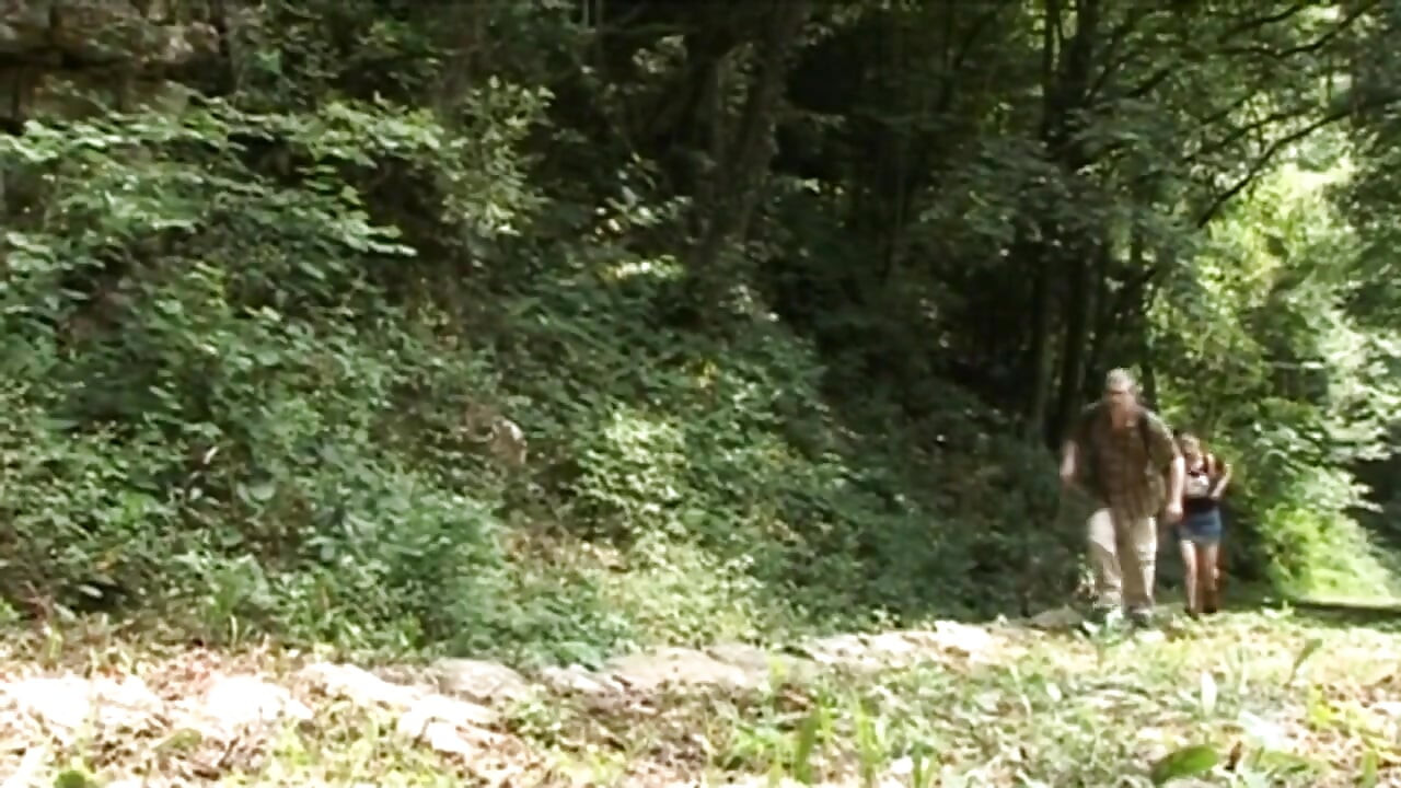 Naughty teen gets fucked by a mature guide in the woods