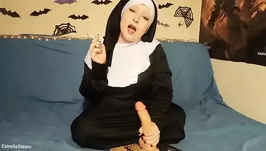 The nun jerks off her dildo while smoking