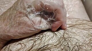 A nice hot bath playing with my ball sack and letting the piss flow all over my hairy body