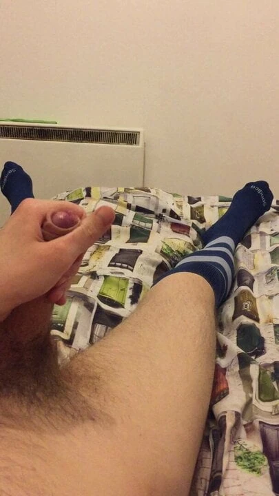 Stroking in football socks