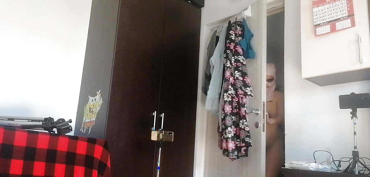 Amateur woman has fun trying on clothes and cutting them. Amateur woman vacuums naked in the house.
