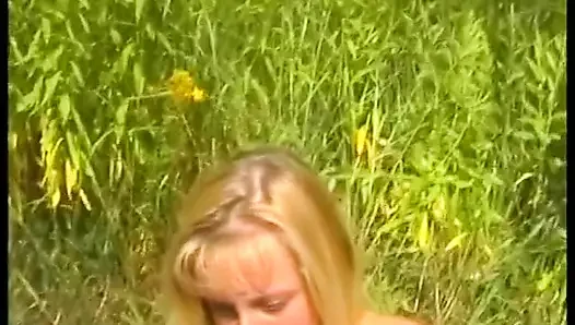 Hairy blonde chick fills her pussy with carrot outdoors