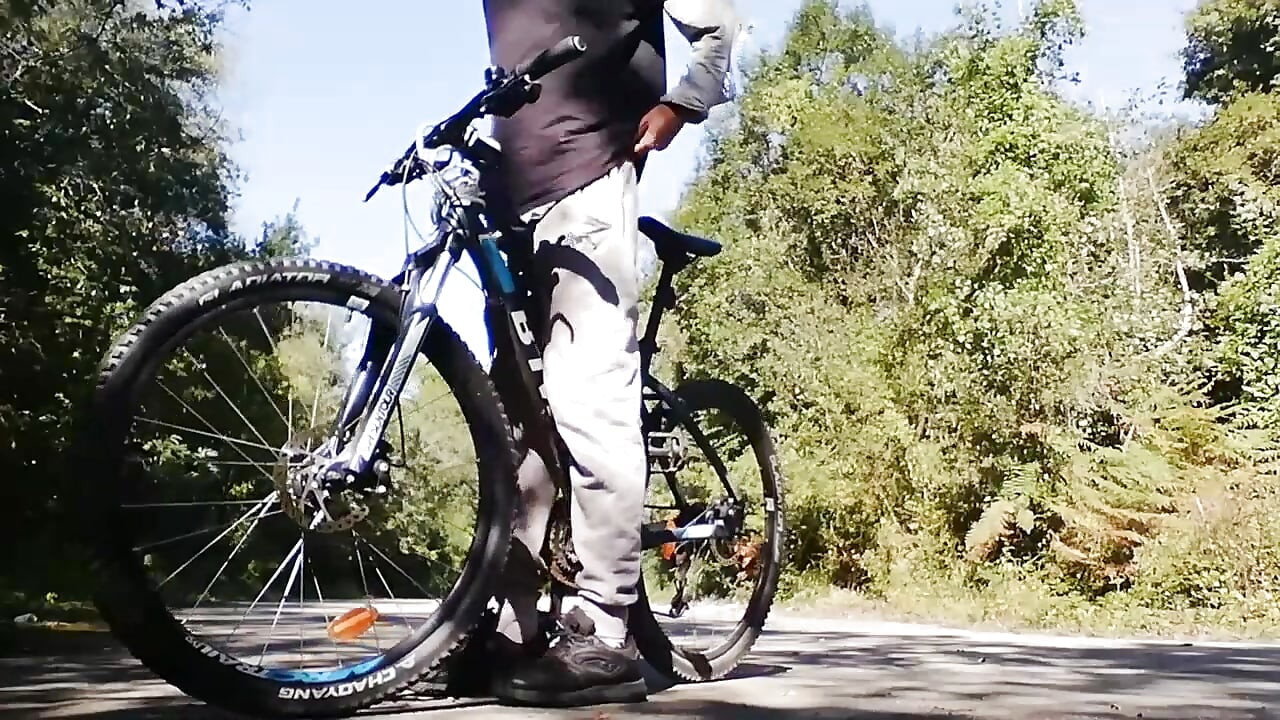 Young man playing with his bike with dildo in his ass