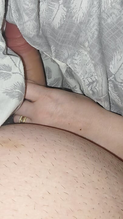 Step sister surprises step brother with a handjob while they watch a movie