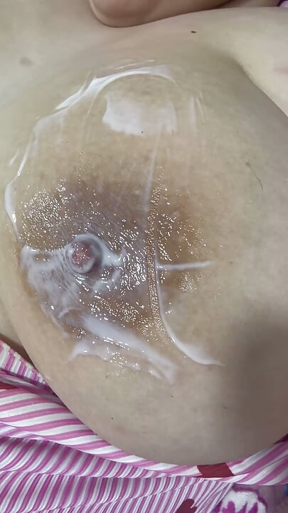 Mom plays with her cream on her delicious huge tits