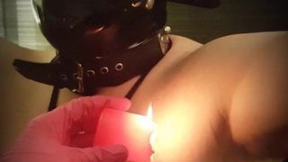 Nipple torture with candle wax