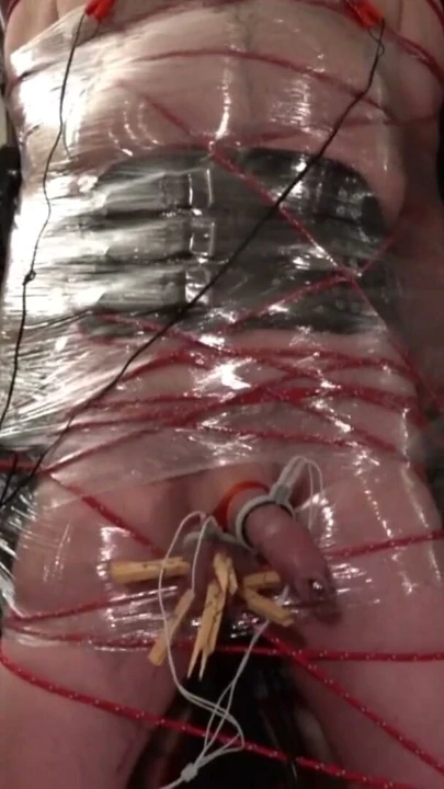 Frankenslave is suspended in cling film bondage with electro play in the dungeon of Lady Diva Cane | Clip 1