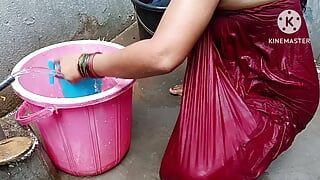 Indian housewife bathing with