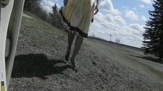 Sissy Ray outdoors on windy day gold dress