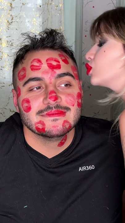 Red Lipstick Kisses Cover His Entire Face