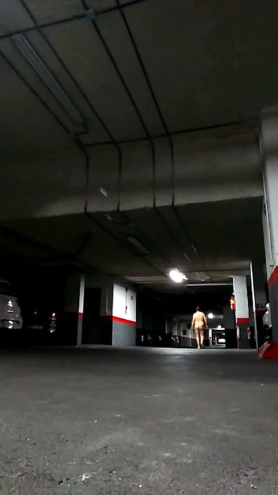 Naked in an underground parking lot