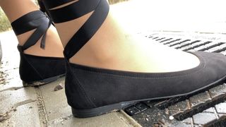 Crossdresser posing outdoor with lace ballerinas and nylons