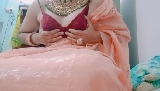 Indian Gay Crossdresser Gaurisissy pressing her big boobs and fingering in her clean shaved big ass in red saree