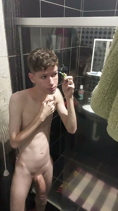 A Twink showing his body and naked at shower