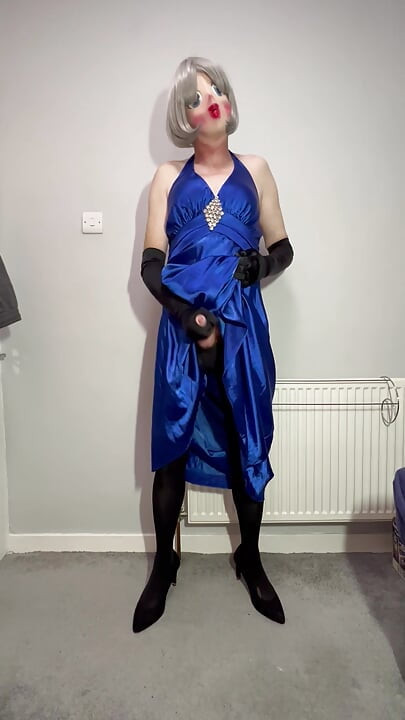 Sissy crossdresser playing in a satin ball gown