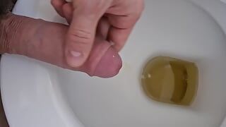 Jerking off, pissing and cumming all in one
