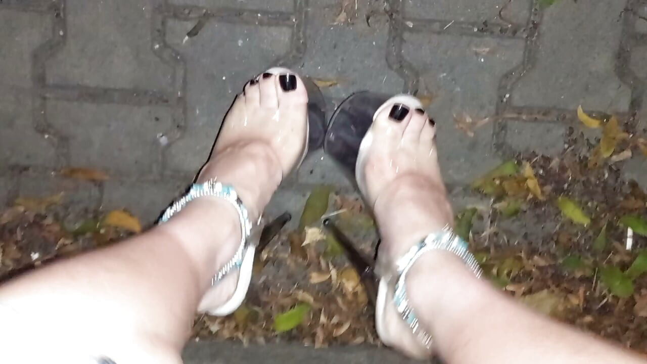 nighttime crossdressing on a public street in 20cm stripper heels, black toes, and black claws