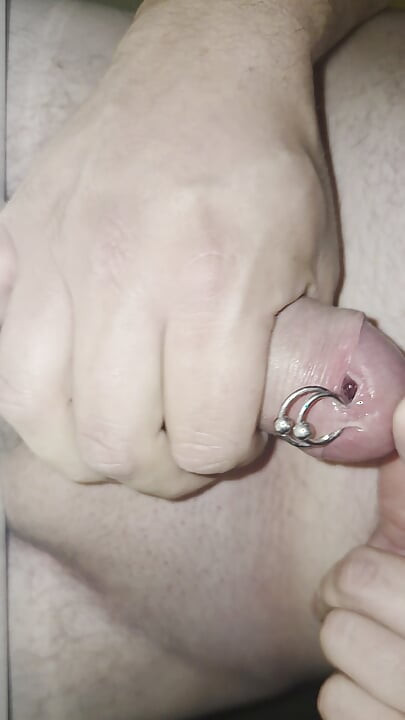 Cum trough piercing hole.