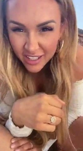 Sexy blonde plays with pussy in the garden