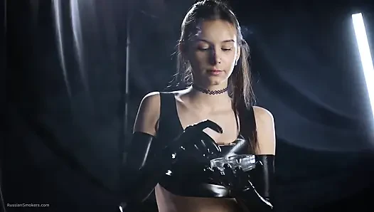 Brunette Smoking in Black Latex Outfit Slow Sensual Scene